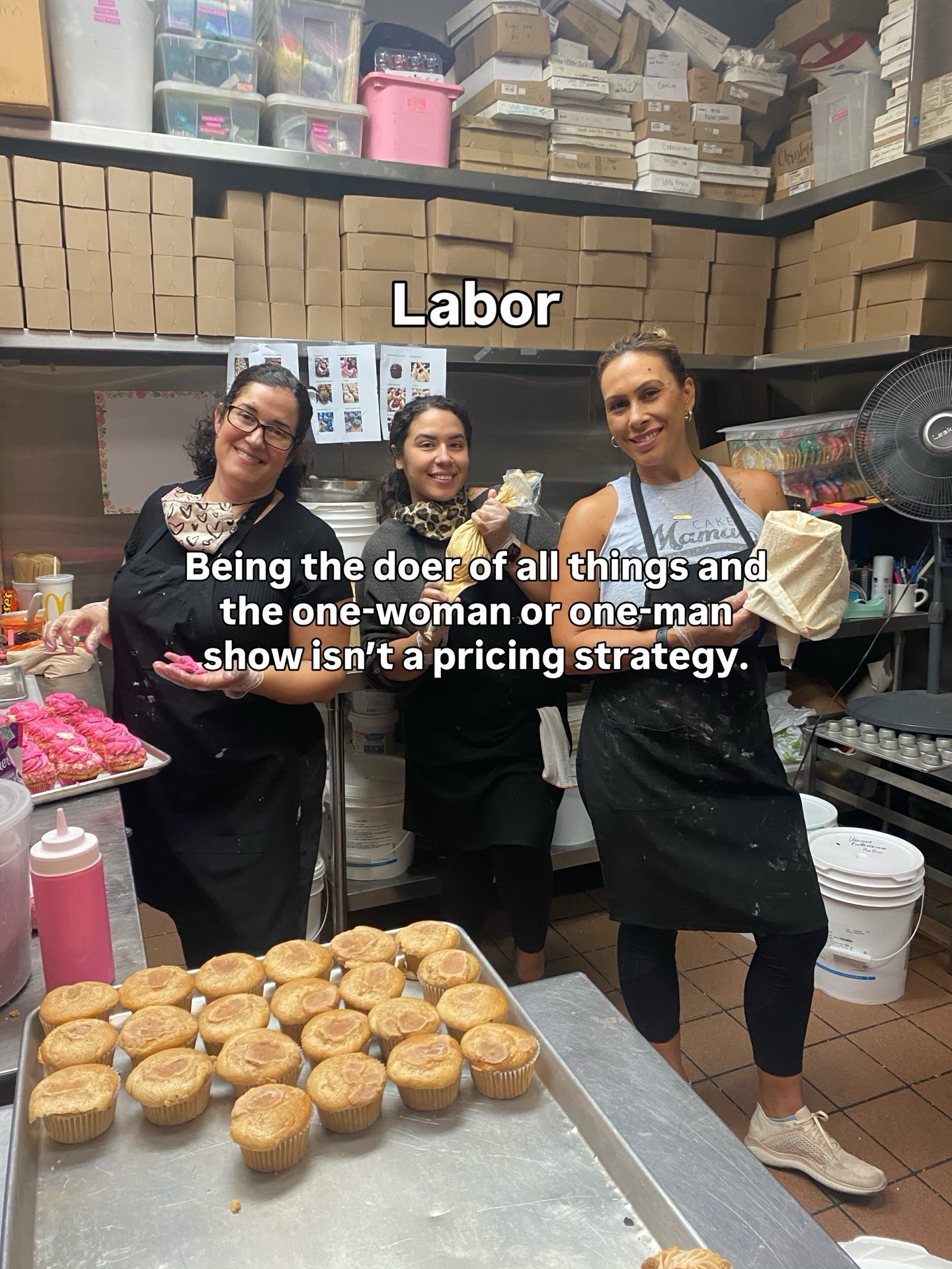 Janelle's bakery team with trays of cupcakes at The Cake Mamas